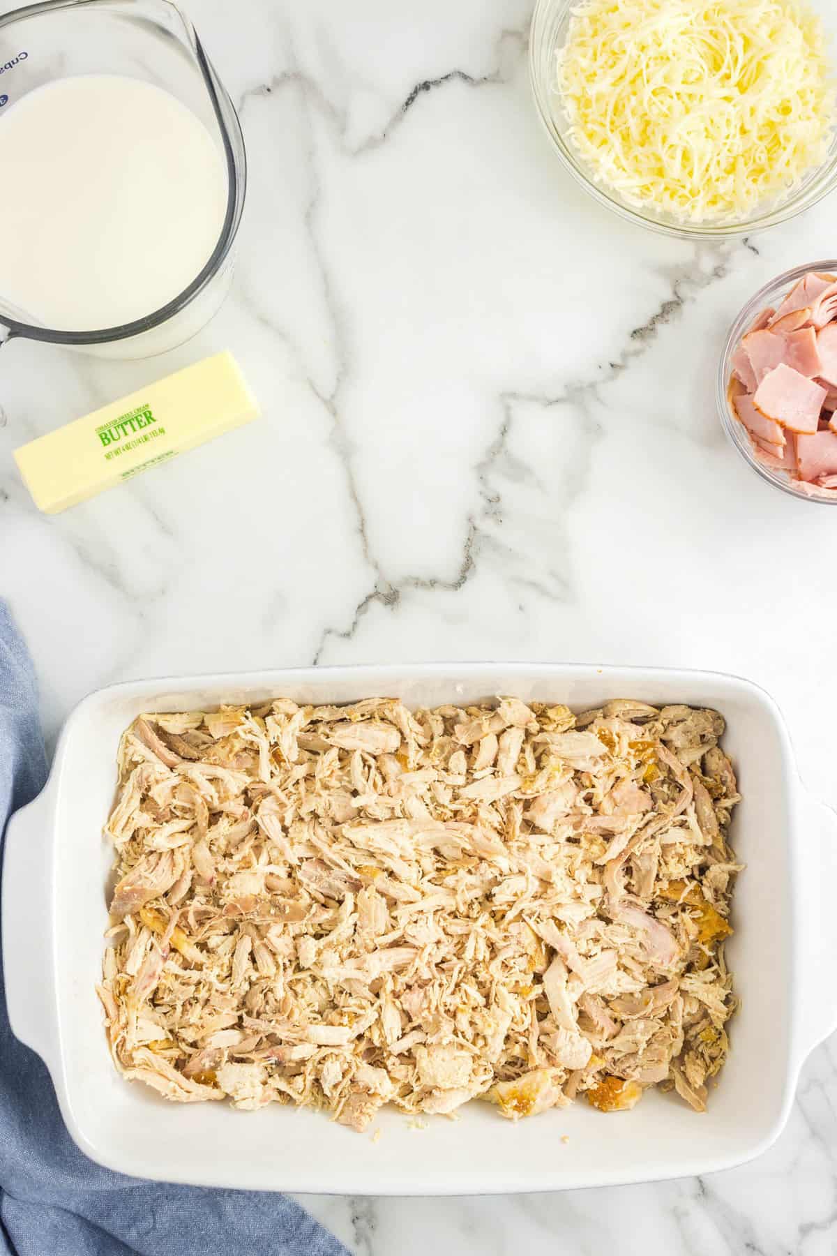 Shredded Chicken in Baking Pan for Easy Chicken Cordon Bleu Casserole