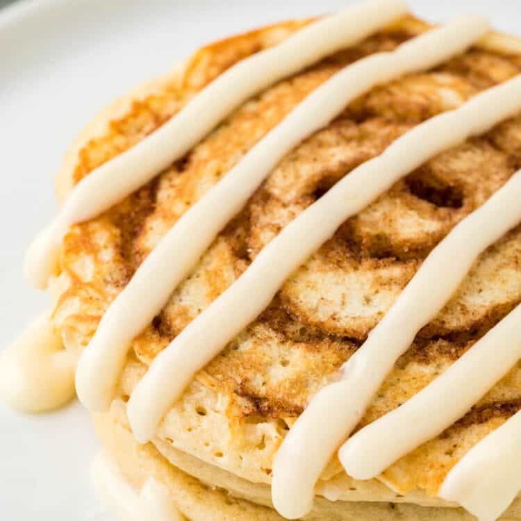 Cinnamon Swirl Pancakes on Plate Drizzled with Cream Cheese Icing