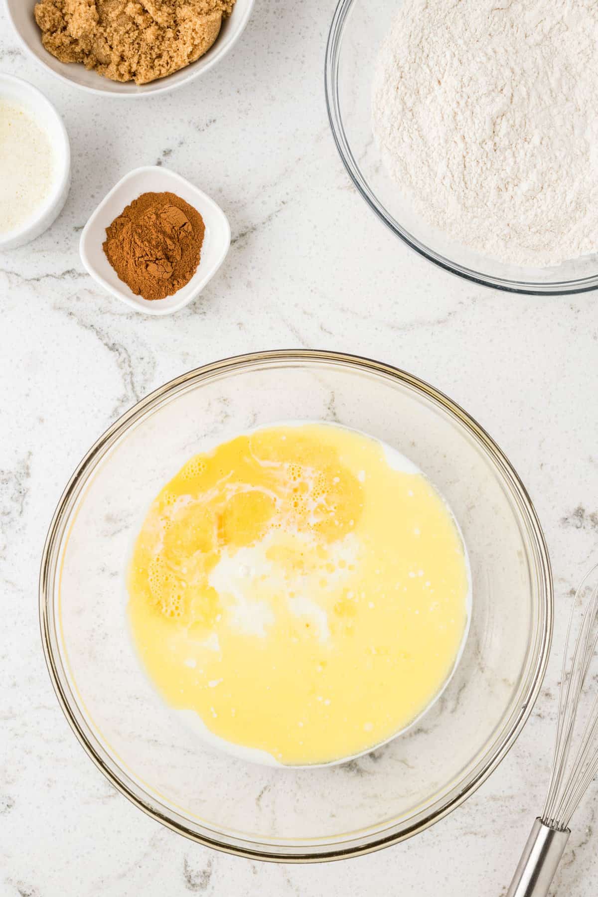 Adding Wet Ingredients for Cinnamon Roll Pancake Recipe