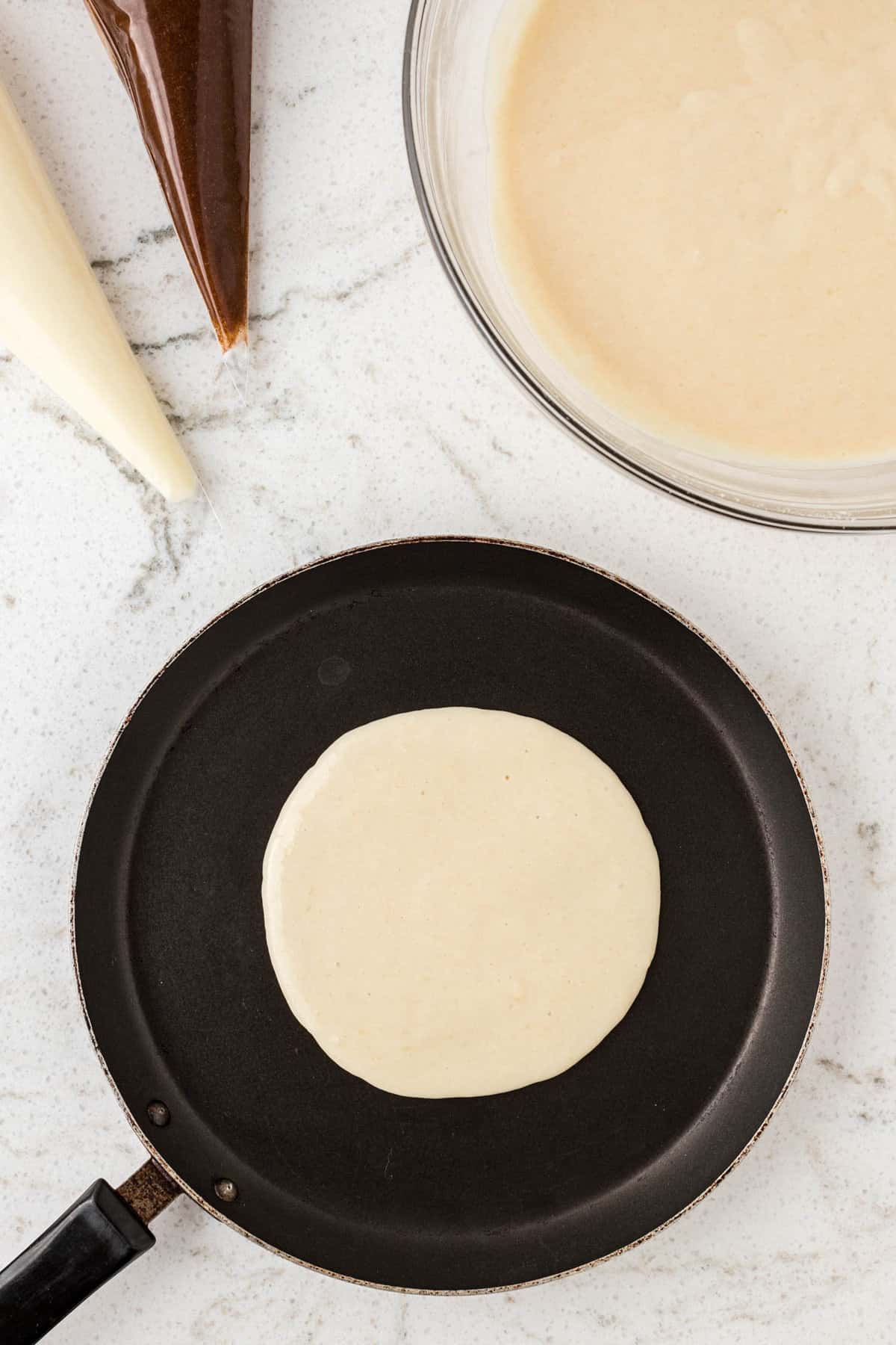 Pancake on Griddle for Cinnamon Roll Pancake Recipe