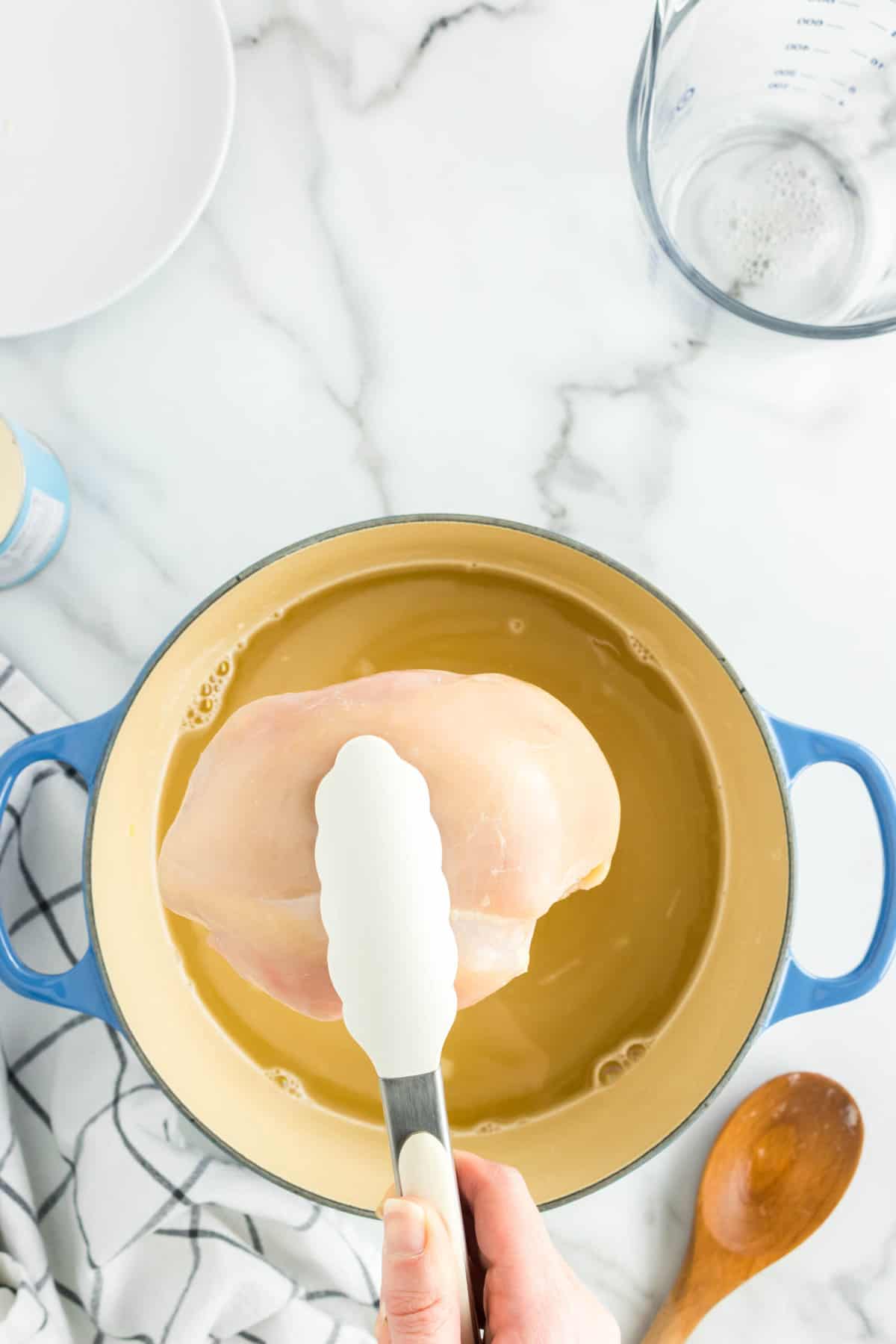 Stirring in Broth & Adding Chicken to Homemade Creamy Chicken Noodle Soup