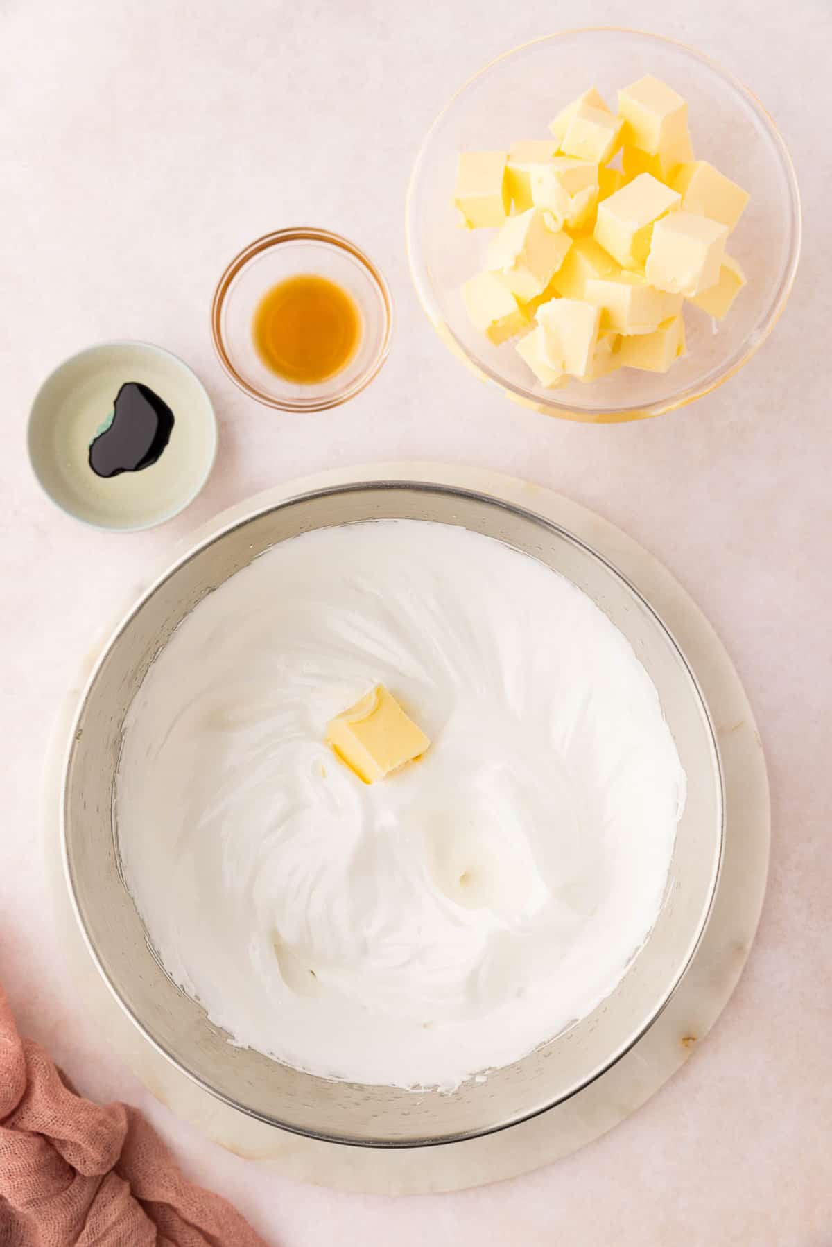 Adding Butter to Swiss Meringue Frosting for Easter Cupcakes