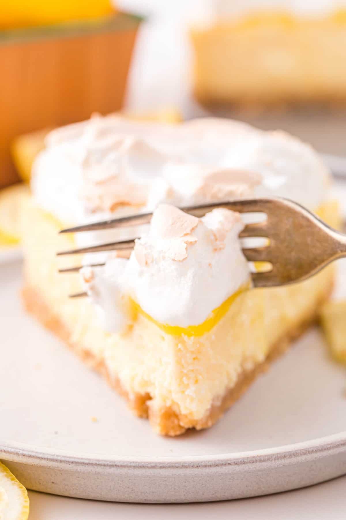 Tart, Tangy, and Creamy Lemon Meringue Cheesecake Recipe on Plate
