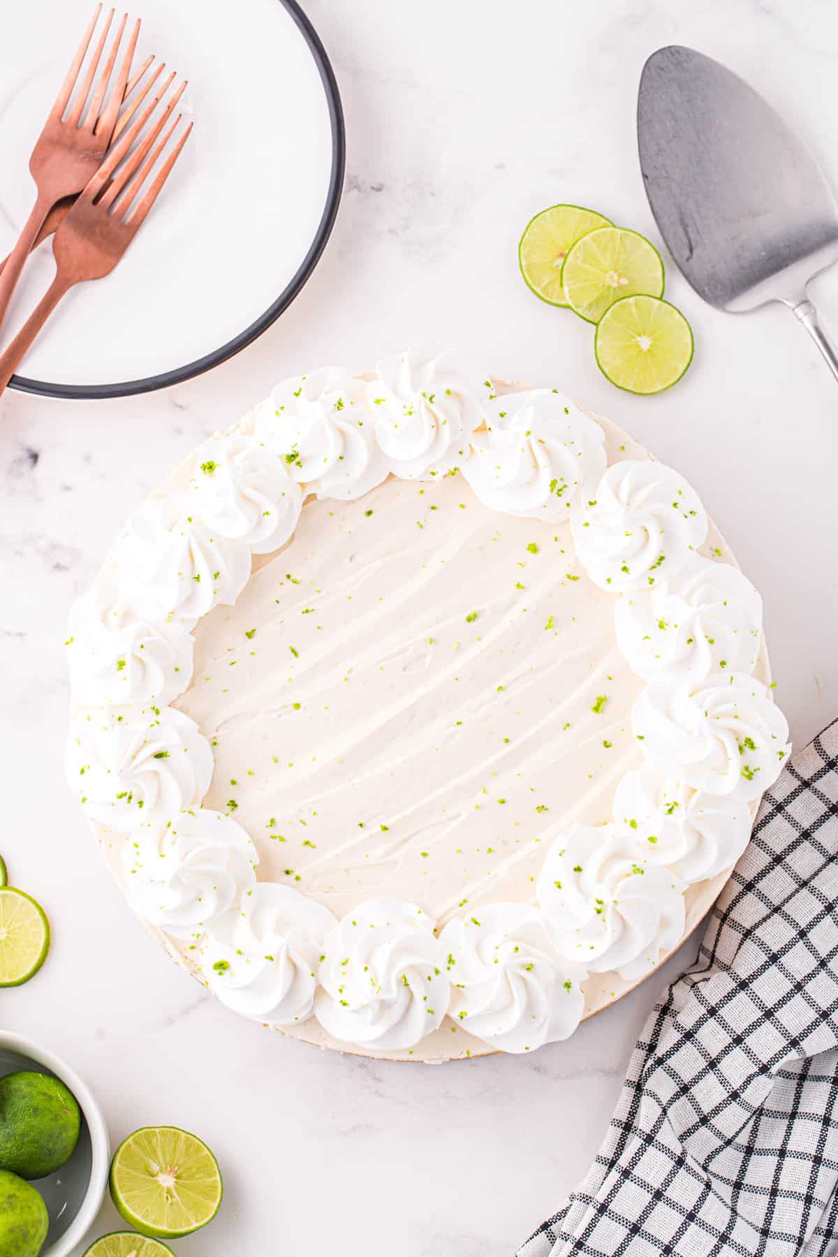 No Bake Key Lime Cheesecake Recipe Topped with Whipped Cream and Key Lime