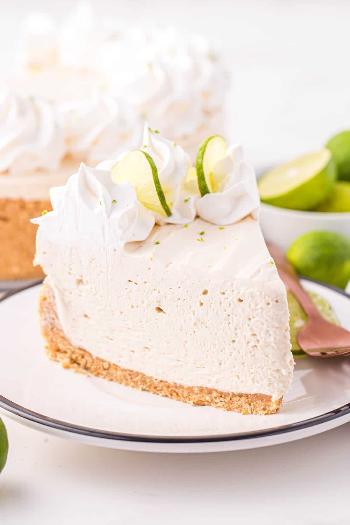 Slice of Keylime cheesecake on white plate