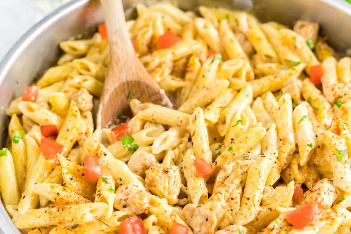 Creamy Cajun Chicken Pasta Recipe with Wooden Spoon