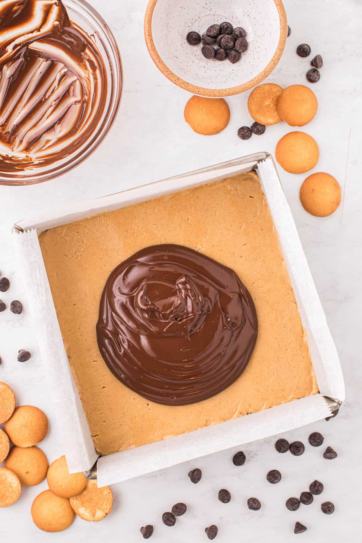 Adding Chocoate Mixture to Square Pan for Chocolate Peanut Butter Bars