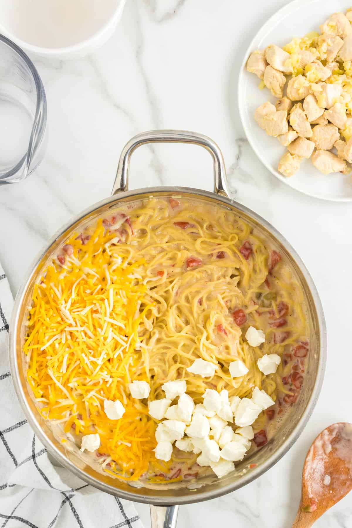One Pot Chicken Spaghetti Recipe in Stovetop Pot with Cheeses Added