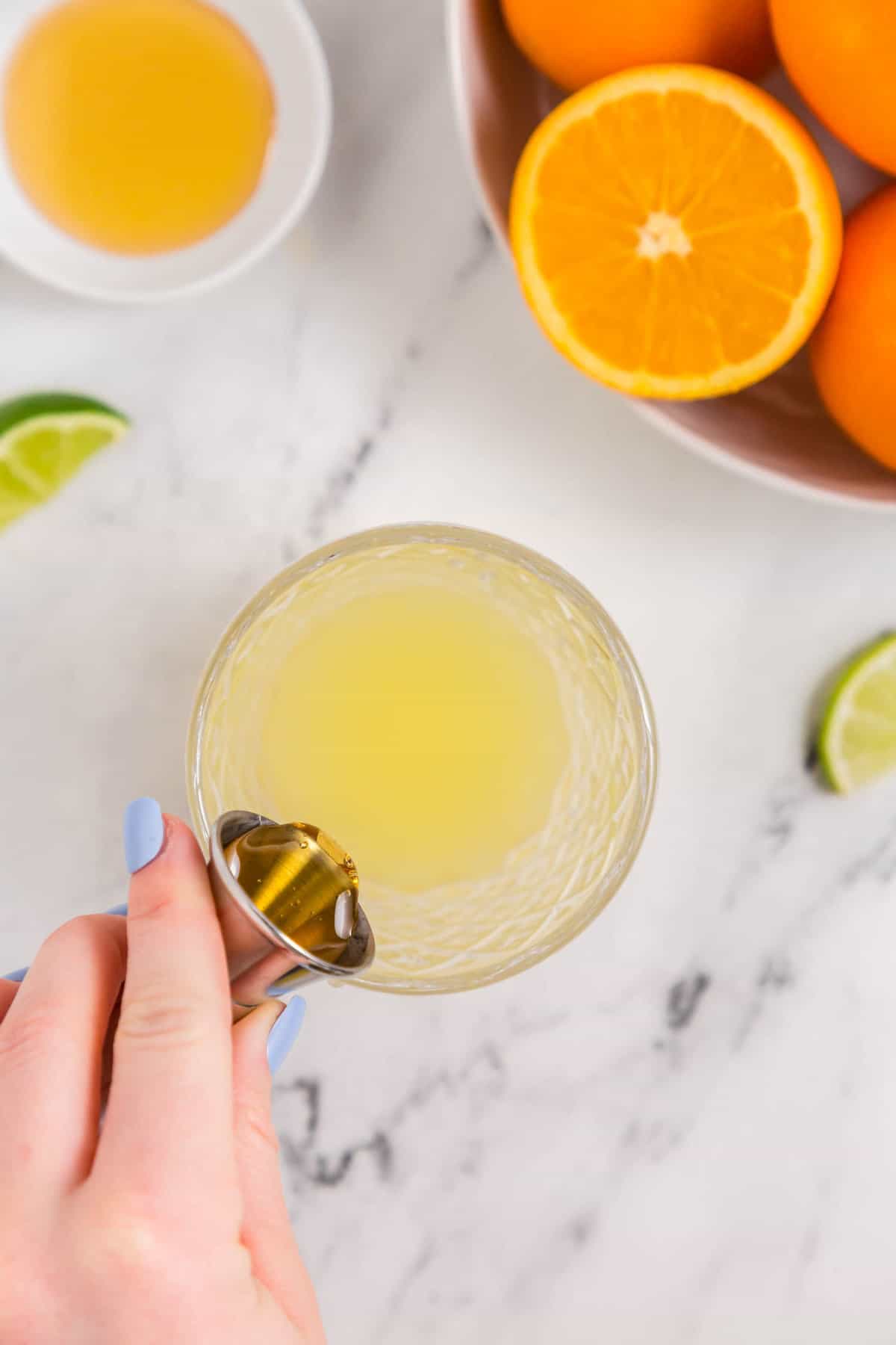 Pouring in Agave Nextor to Skinny Margarita Recipe