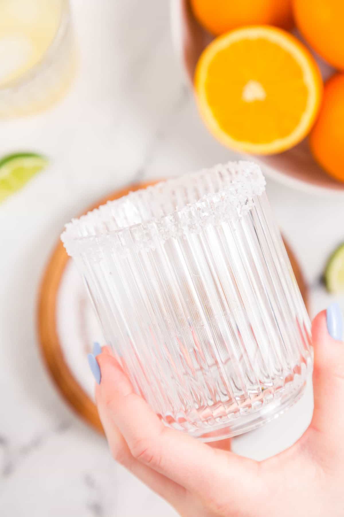 Coating Lime Ring with Course Sea Salt for Skinny Margarita Recipe