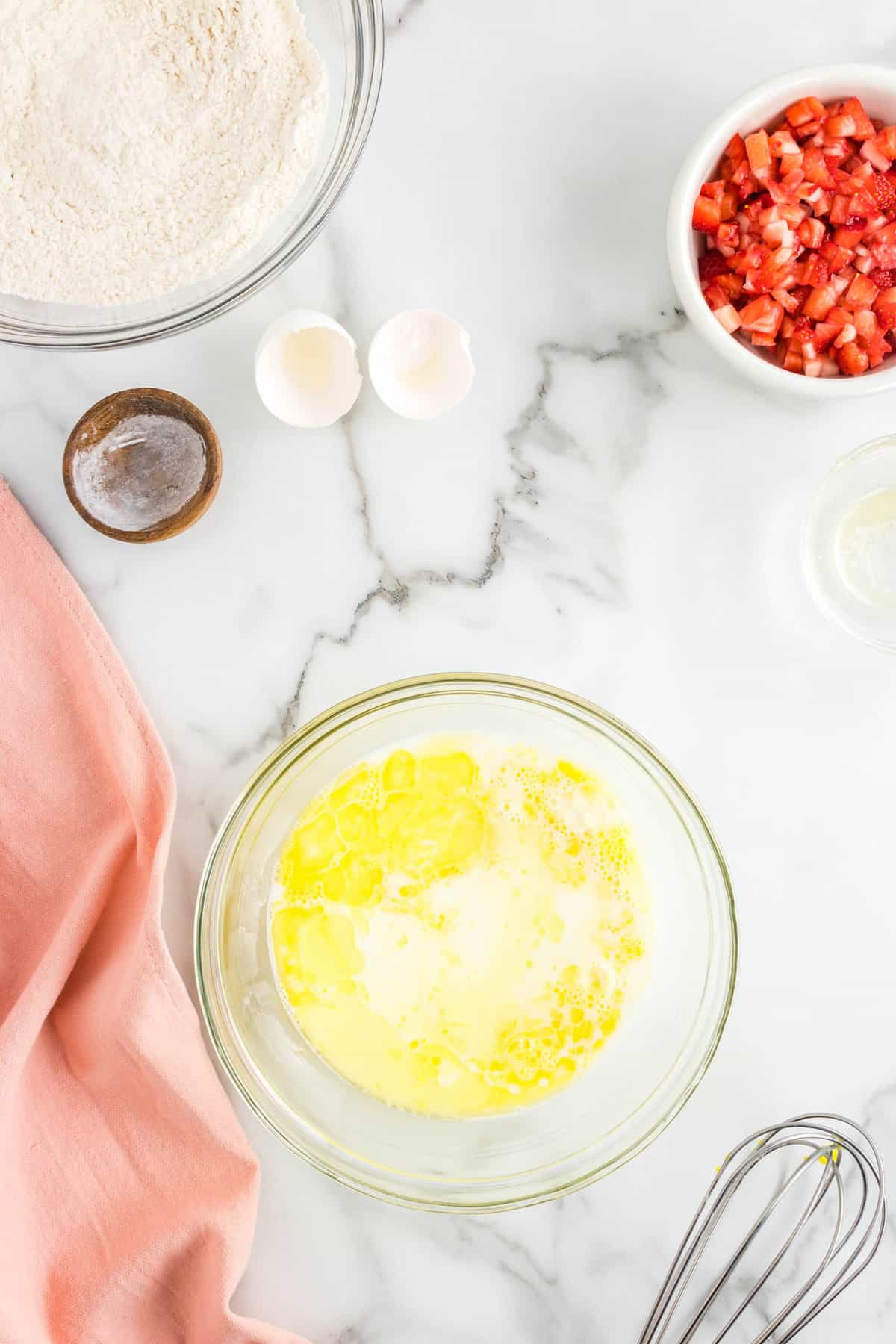 Adding in Wet Ingredients to Batter for Strawberry Pancake Recipe