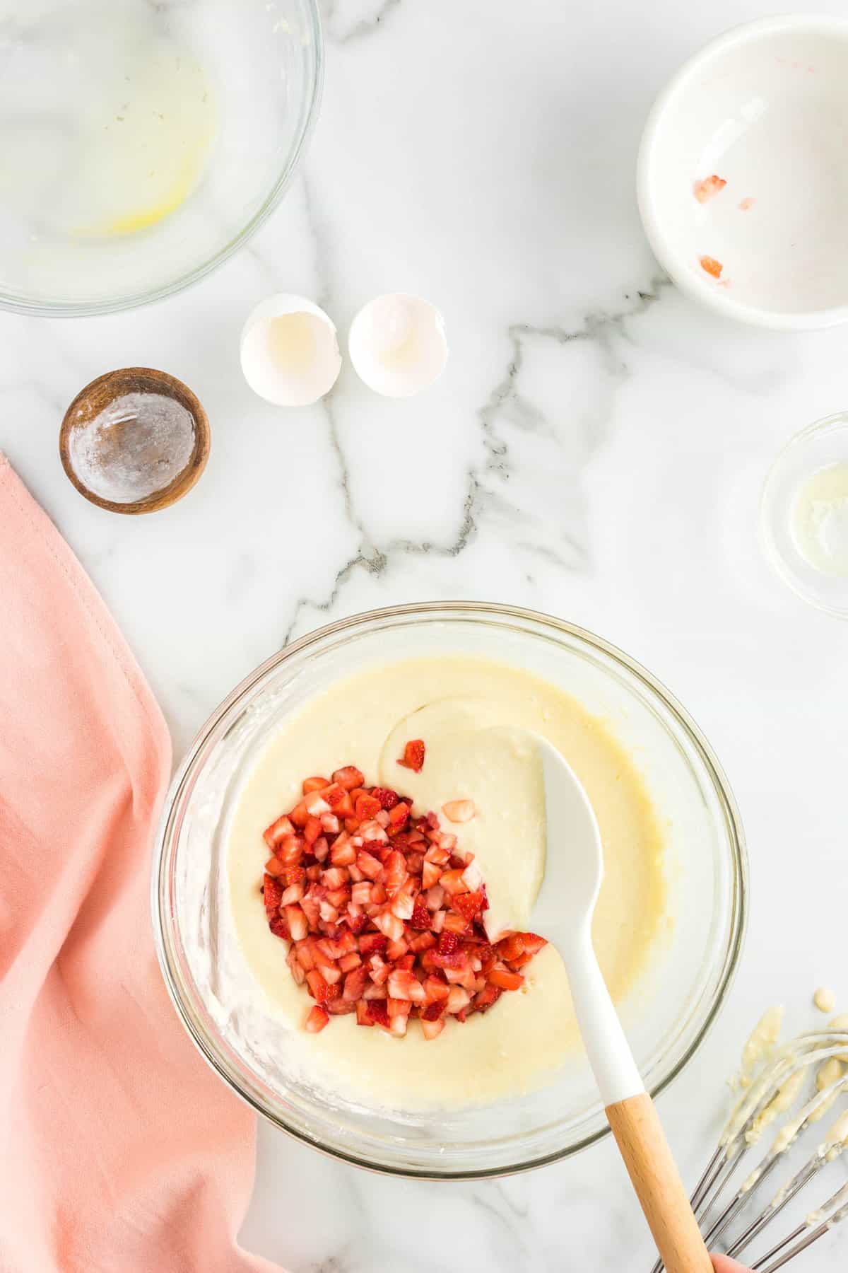 Folding in Fresh Strawberries into Strawberry Pancake Recipe