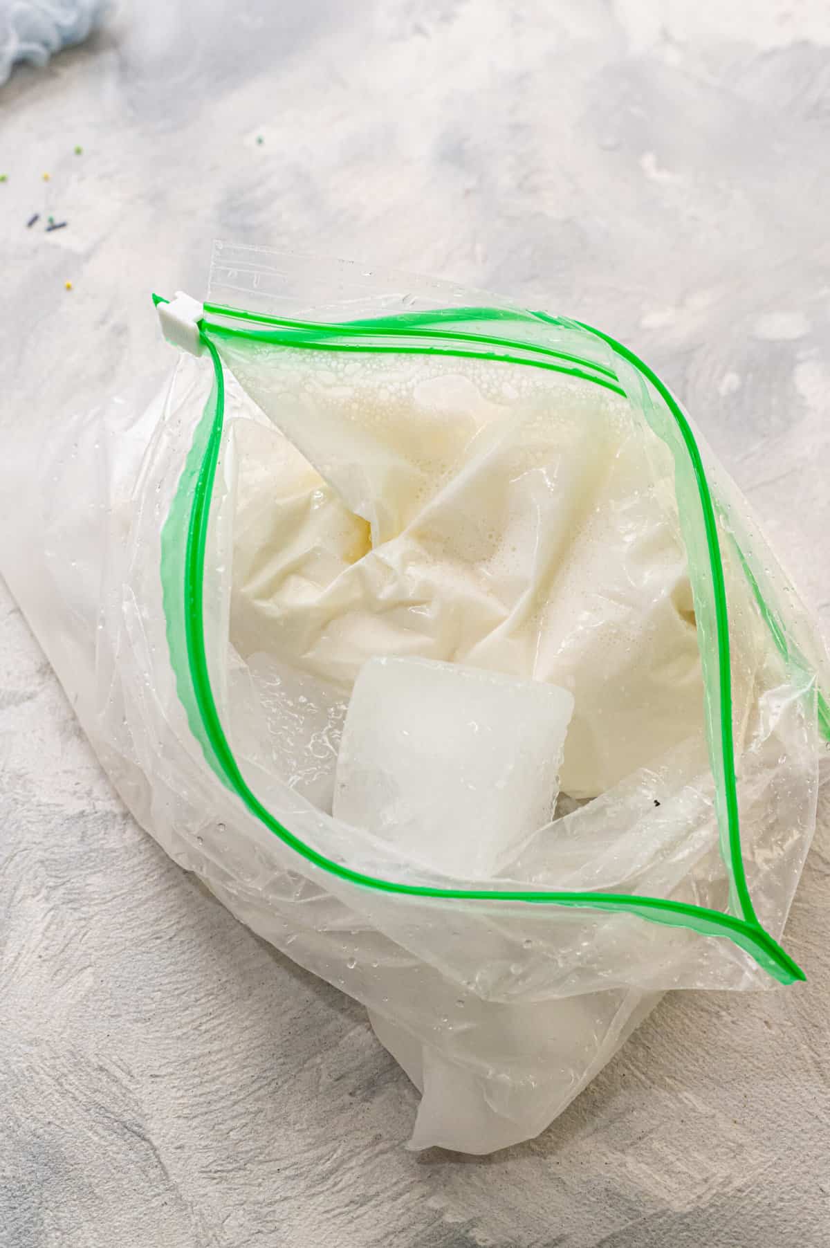 Place ice cream mixture bag into the bigger bag with the ice cream and salt and shake around
