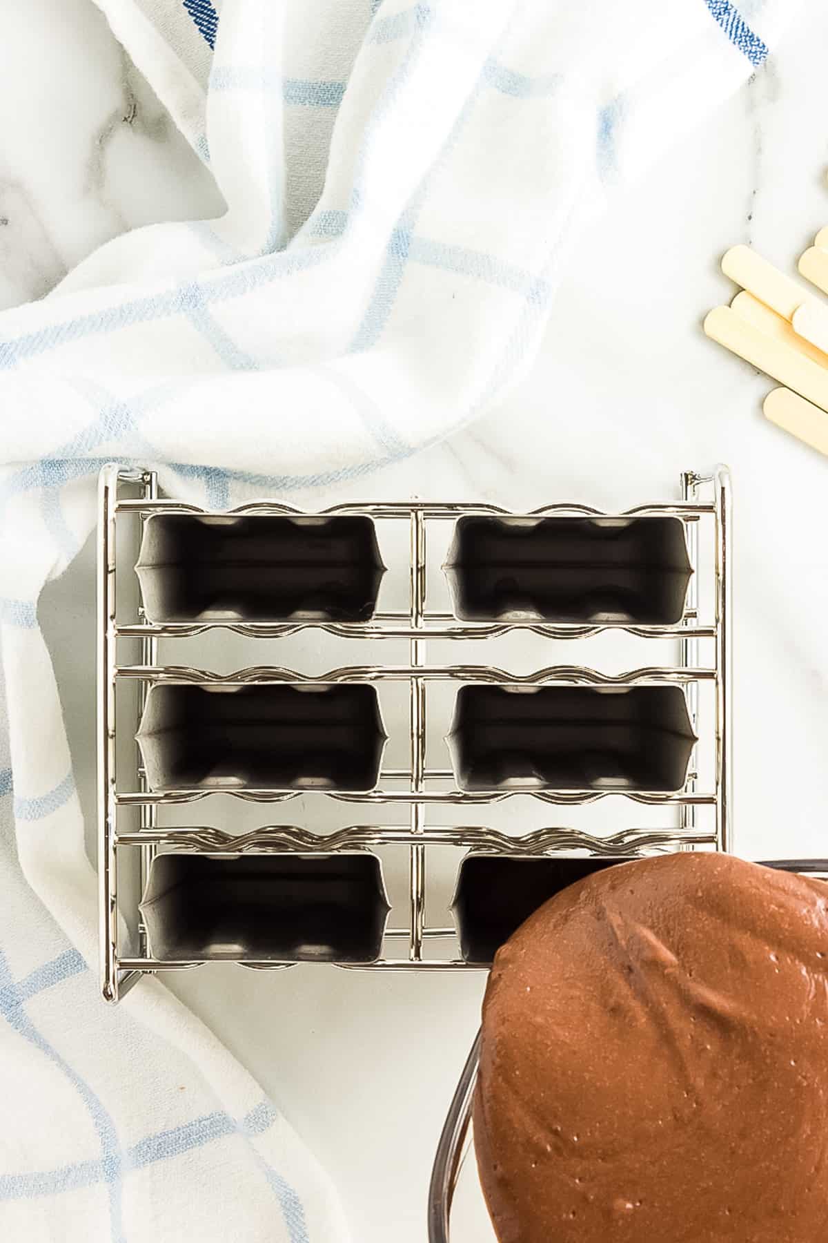 Pour Pudding mix into Popsicle Molds