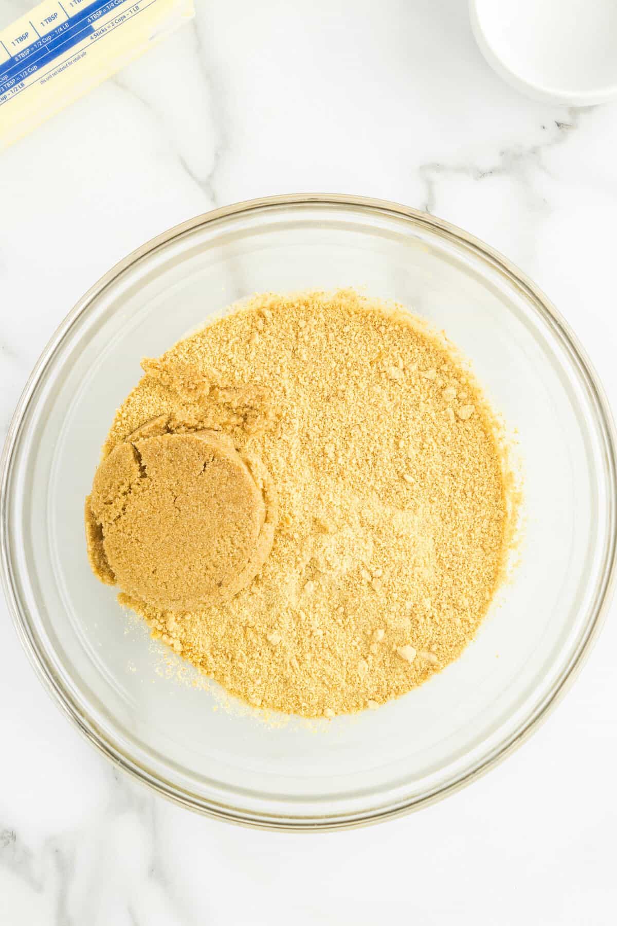 Adding Brown Sugar to Crushed Graham Crackers for Graham Cracker Crust Recipe