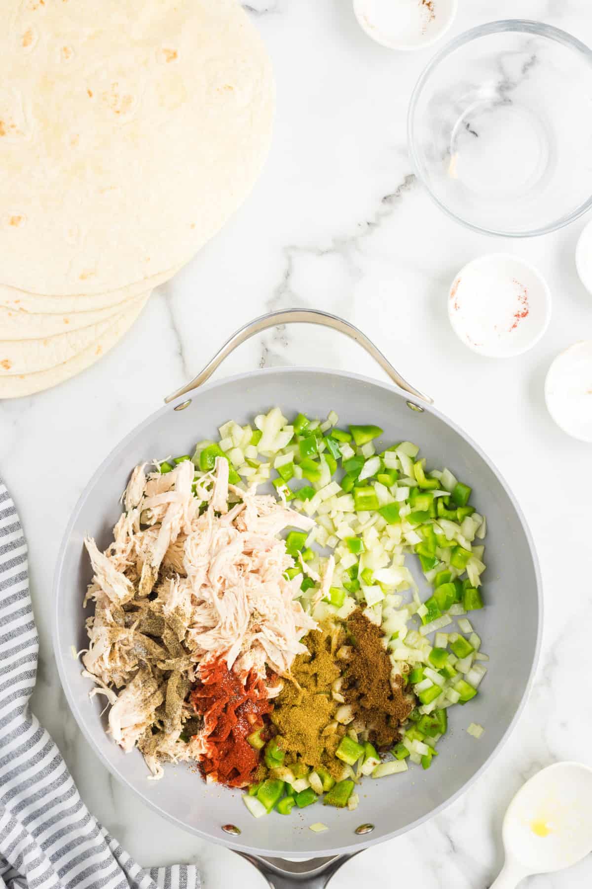 Cooking Ingredients in Stovetop Pan for Sheet Pan Quesadillas