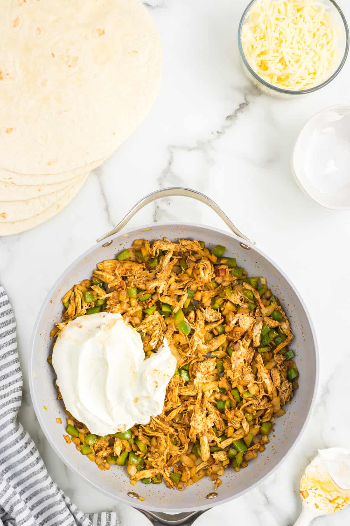 Adding Sour Cream to Mixture for Sheet Pan Quesadillas