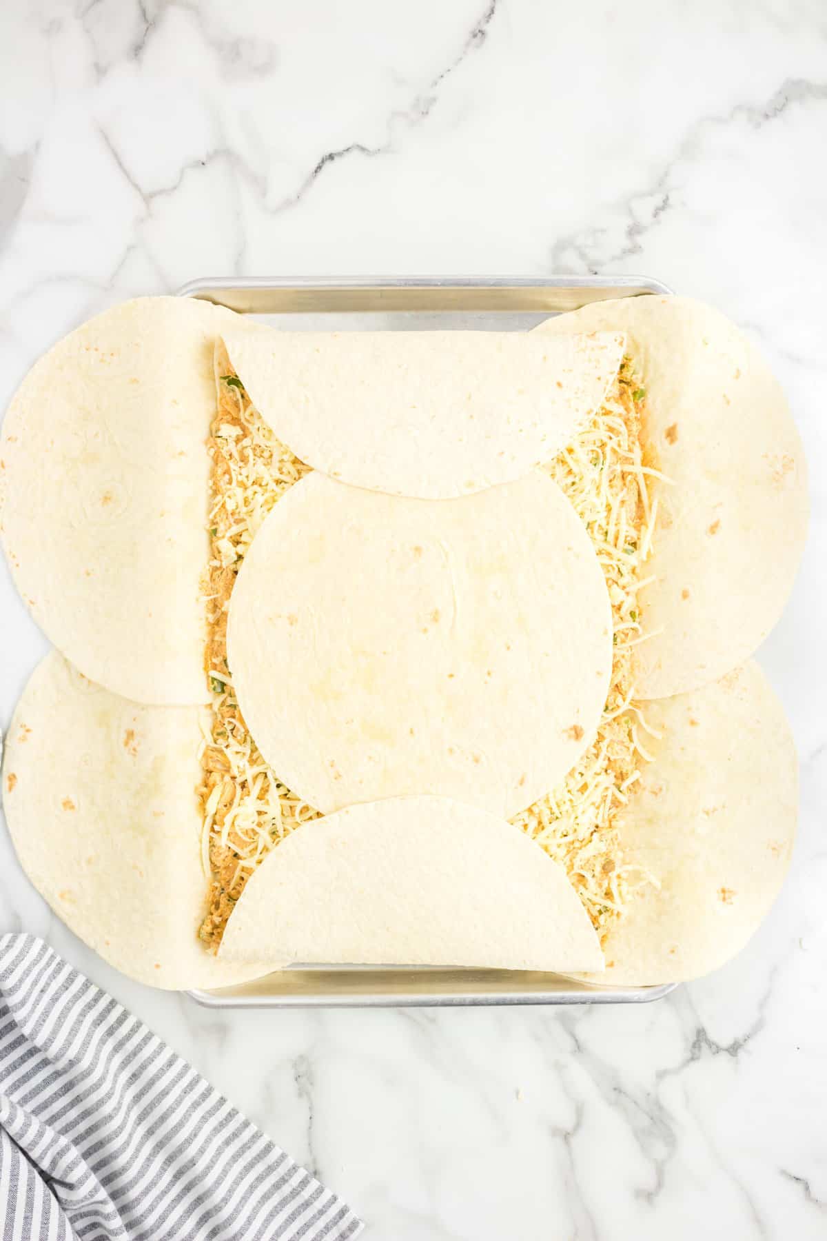 Folding Outer Tortillas Over for Sheet Pan Quesadillas Recipe
