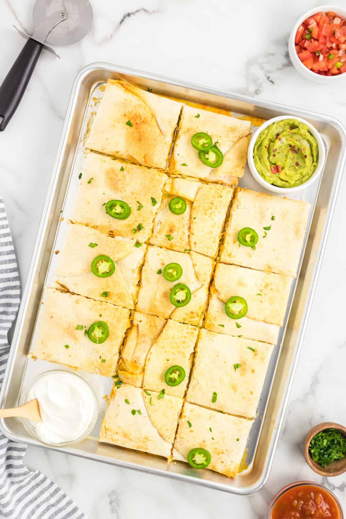 Topping Sheet Pan Quesadillas with Extra Ingredients for Extra Seasoning