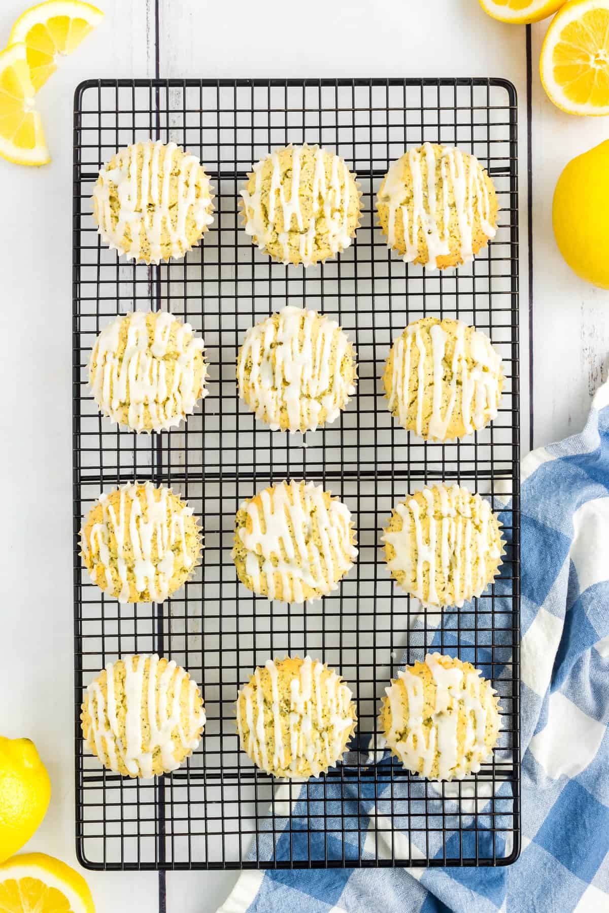 Glaze Drizzled on Lemon Poppy Seed Muffins Atop Cooling Rack