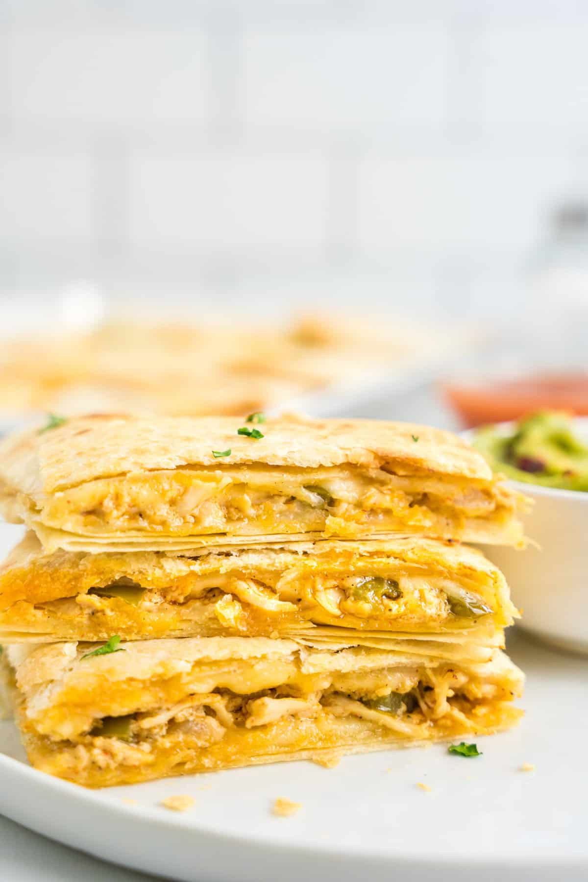Sheet Pan Chicken Quesadillas Cut and Stacked on Plate