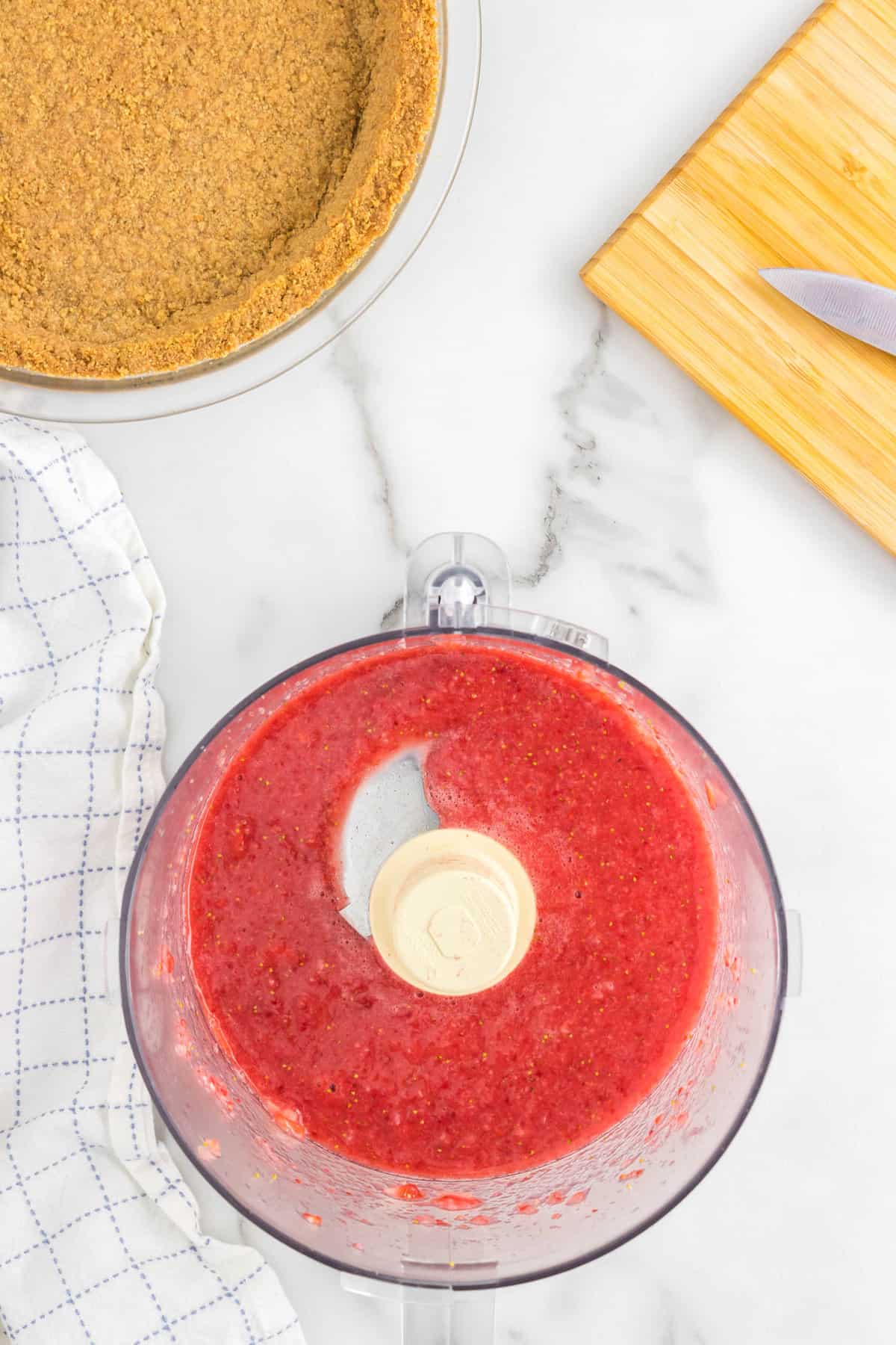 Fresh Strawberries in Food Processor for No Bake Strawberry Cheesecake Recipe