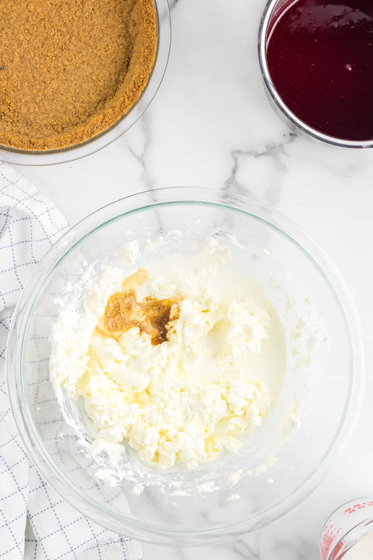 Blended Cheesecake and Vanilla in Batter Bowl for No Bake Strawberry Cheesecake Recipe