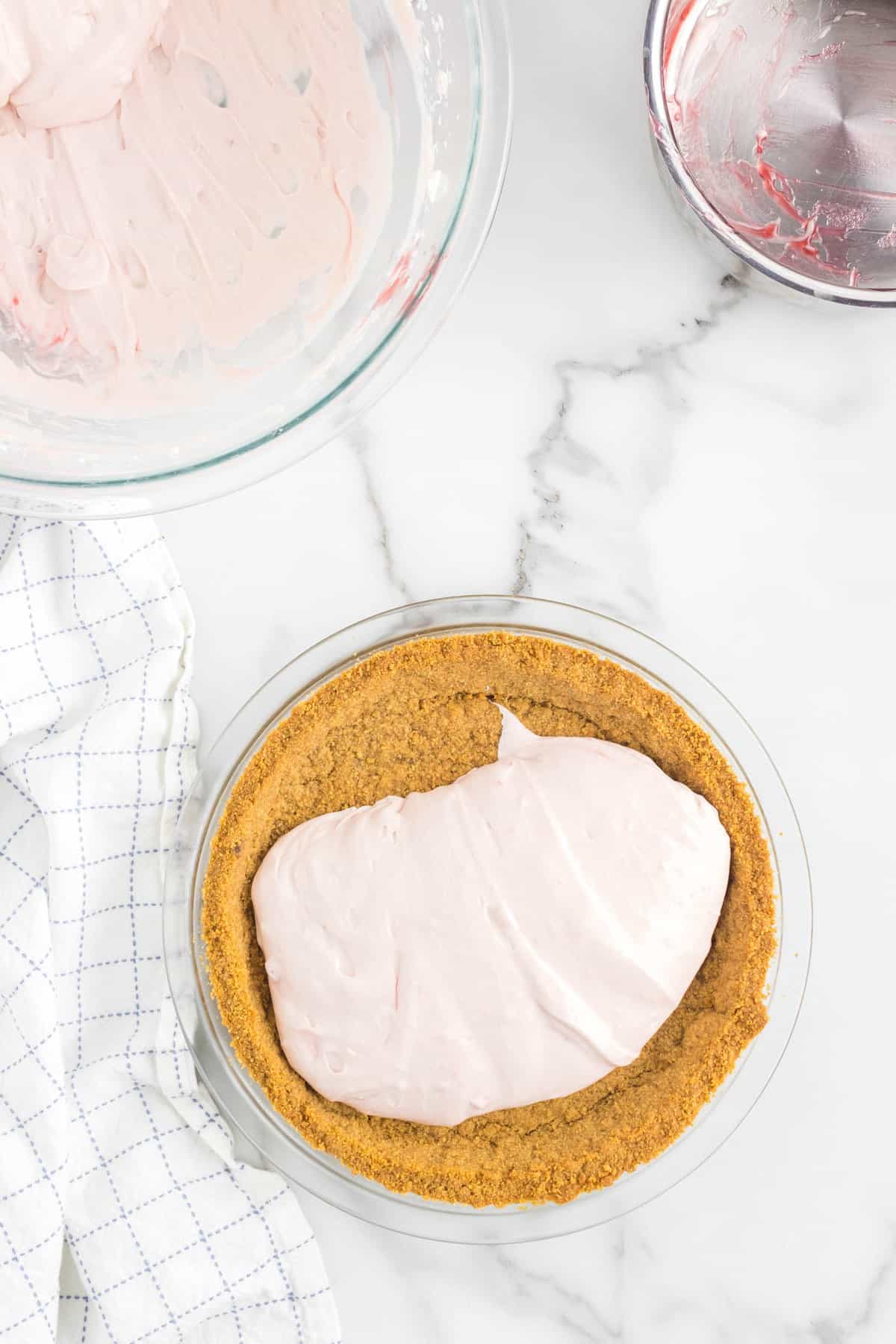 Adding Cheesecake Filling into Graham Cracker Crust for No Bake Strawberry Cheesecake