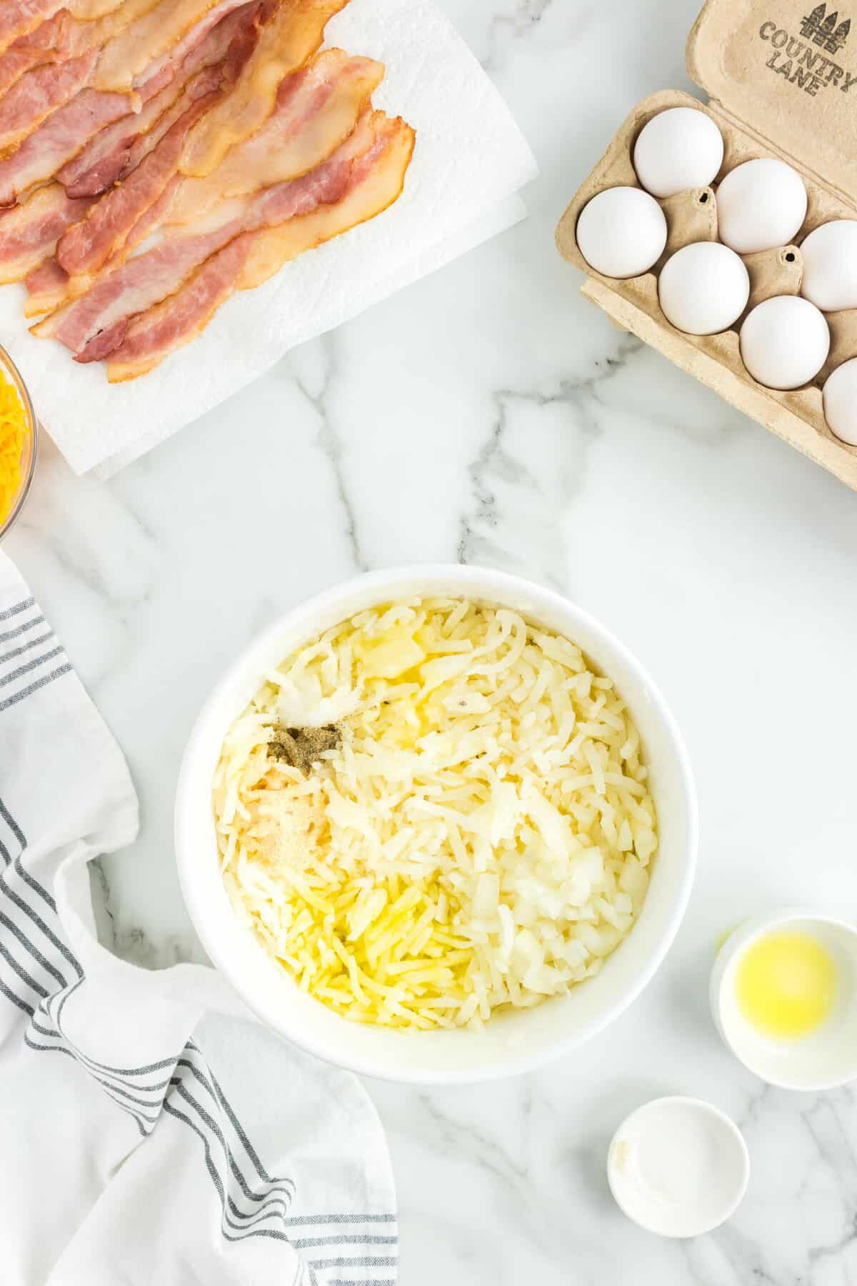 Combining Ingredients in Bowl for Sheet Pan Breakfast