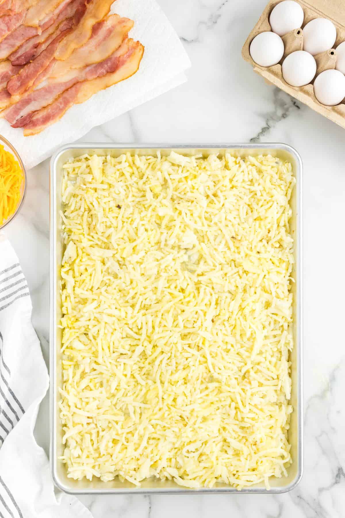 Sheet Pan Breakfast Recipe with Mixture Spread out on Pan
