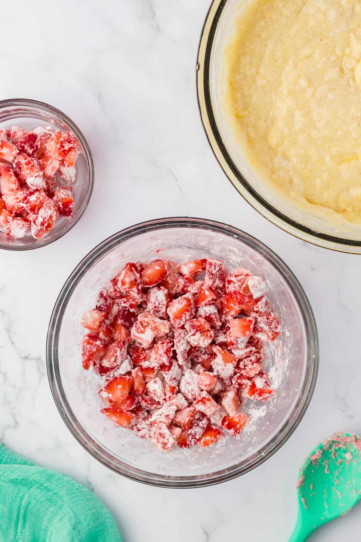 Coating Strawberries with Flour for Homemade Strawberry Muffins