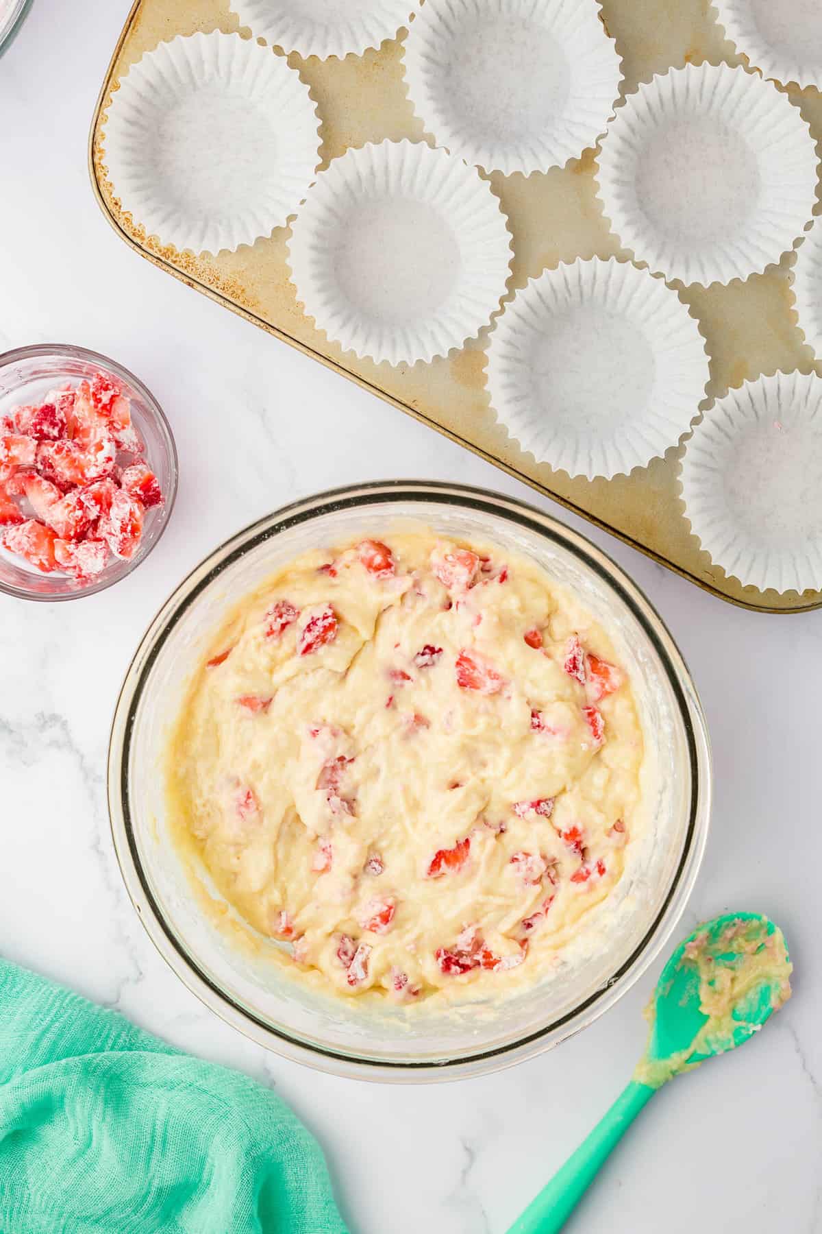 Strawberries Carefully Foldedinto Muffin Batter for Strawberry Muffins