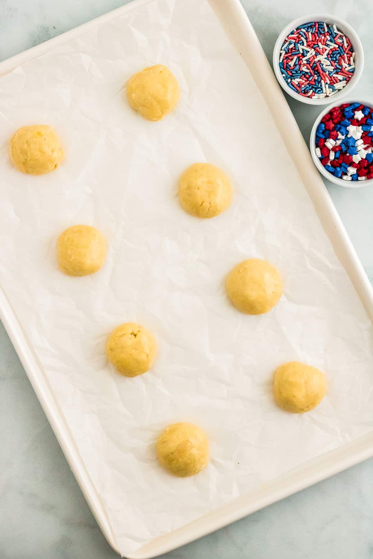 Roll the Cake Mix into 1-1.5 Inch Balls and place on a Cookie Sheet.