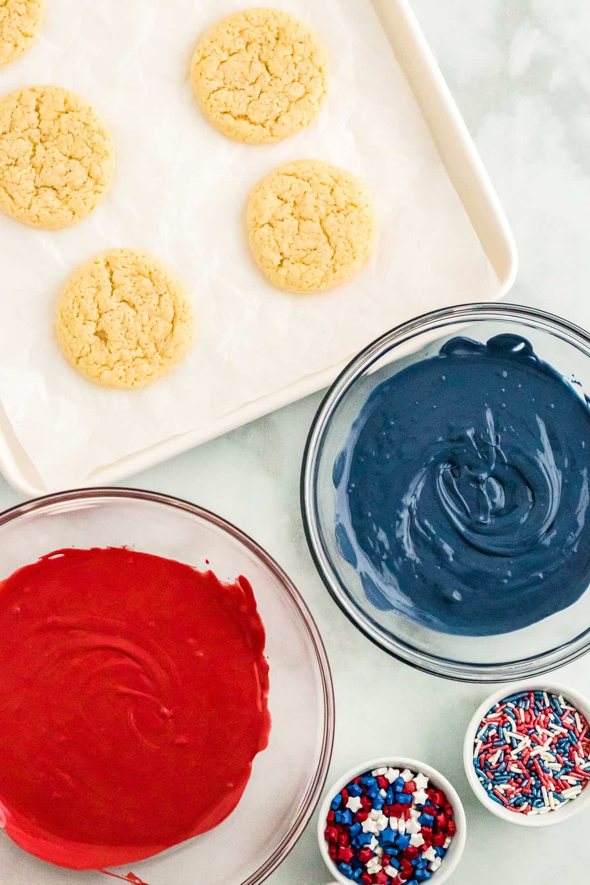 Let the Cookies Cool. Melt the Chocolate in separate bowls.