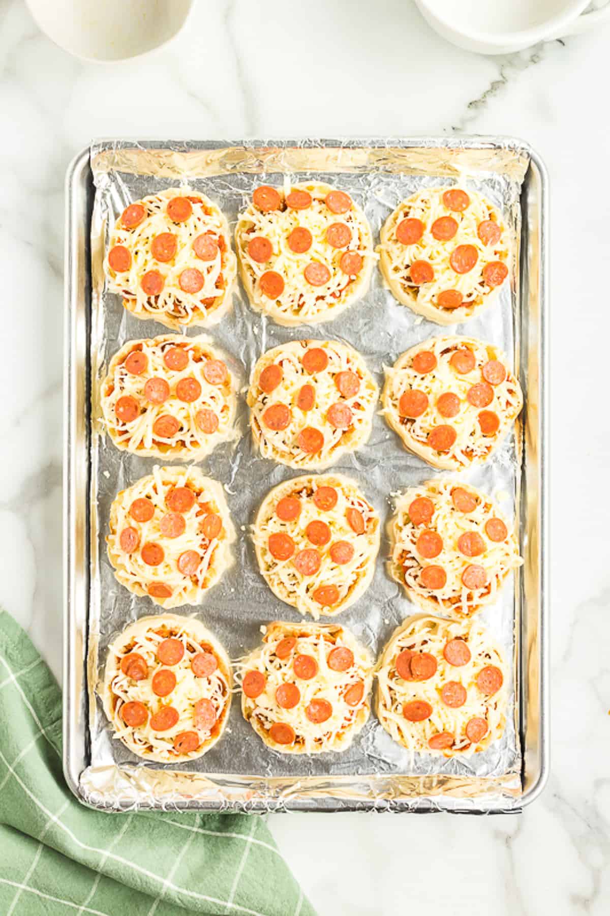 Add mini Pepperonis to the top of the cheese.