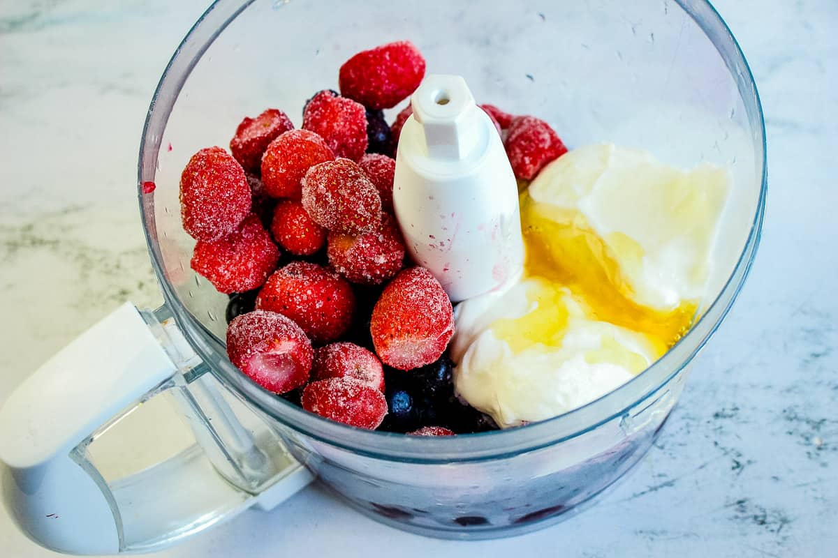 Put all of the berries and yogurt into a mixture and blend together.