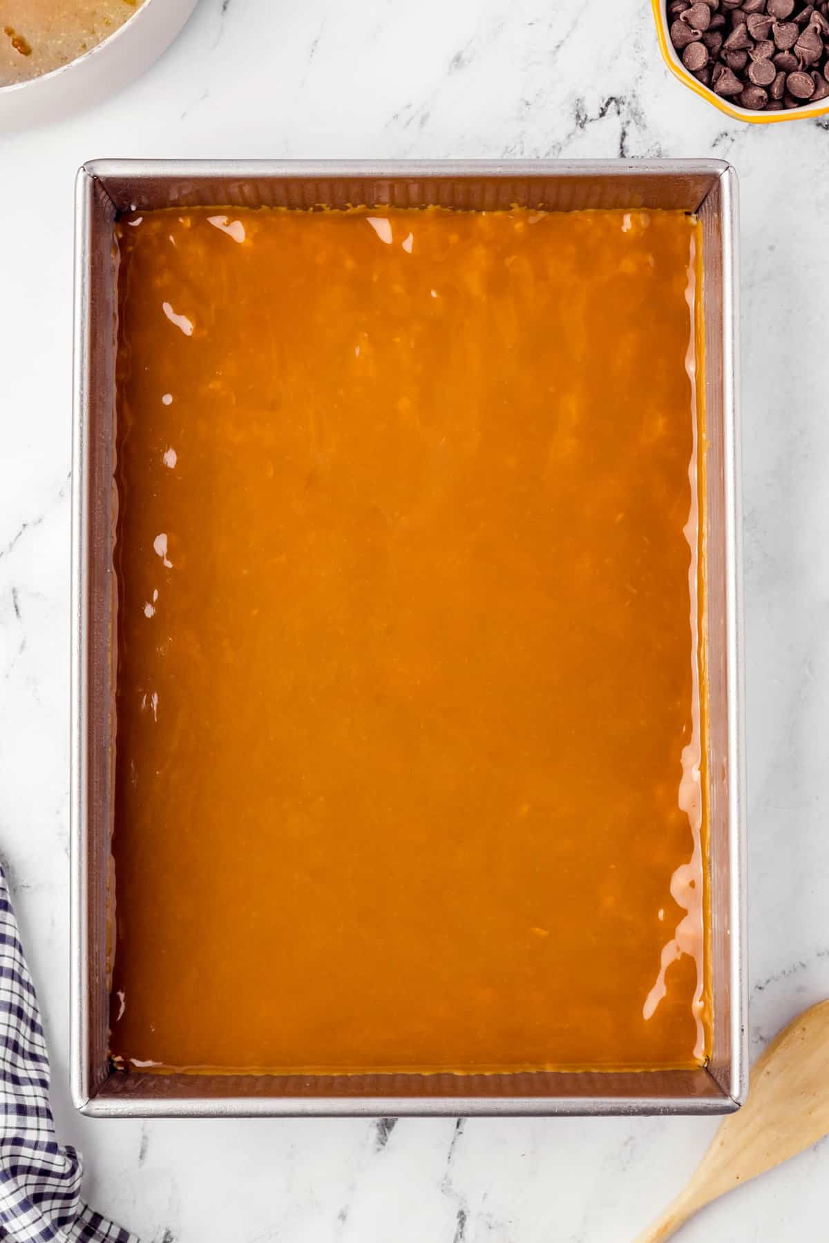 Caramel spread over crust mixture for Caramel Oatmeal Bars