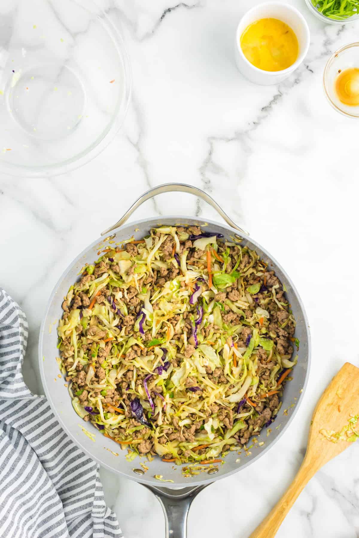 Stirring Egg Roll in a Bowl Recipe in Stovetop Skillet