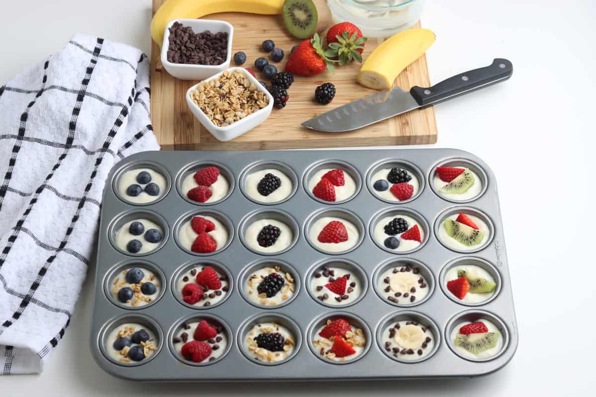 Apply all different types of combinations of Fruit, Chocolate and Granola. Put in Freezer