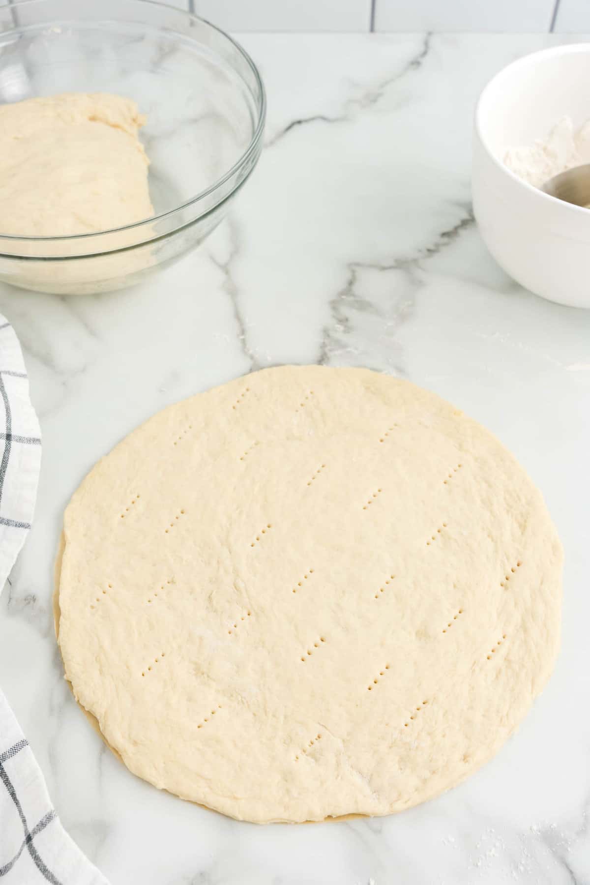 Piercing Homemade Pizza Dough with Fork