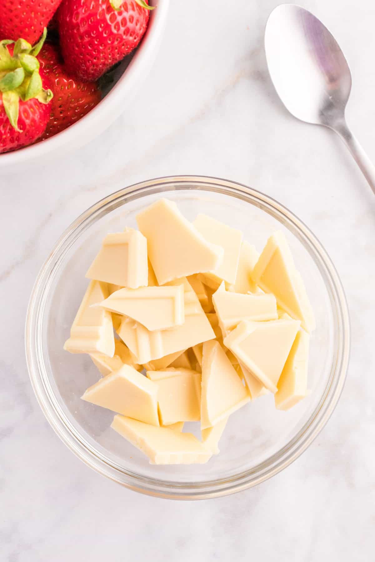 Break up the White chocolate in a glass bowl.