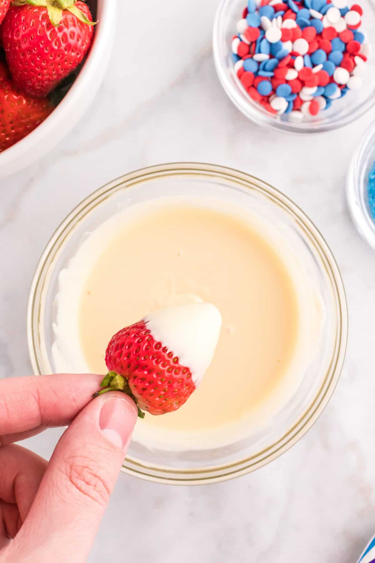 Dip the Strawberries into the white chocolate.