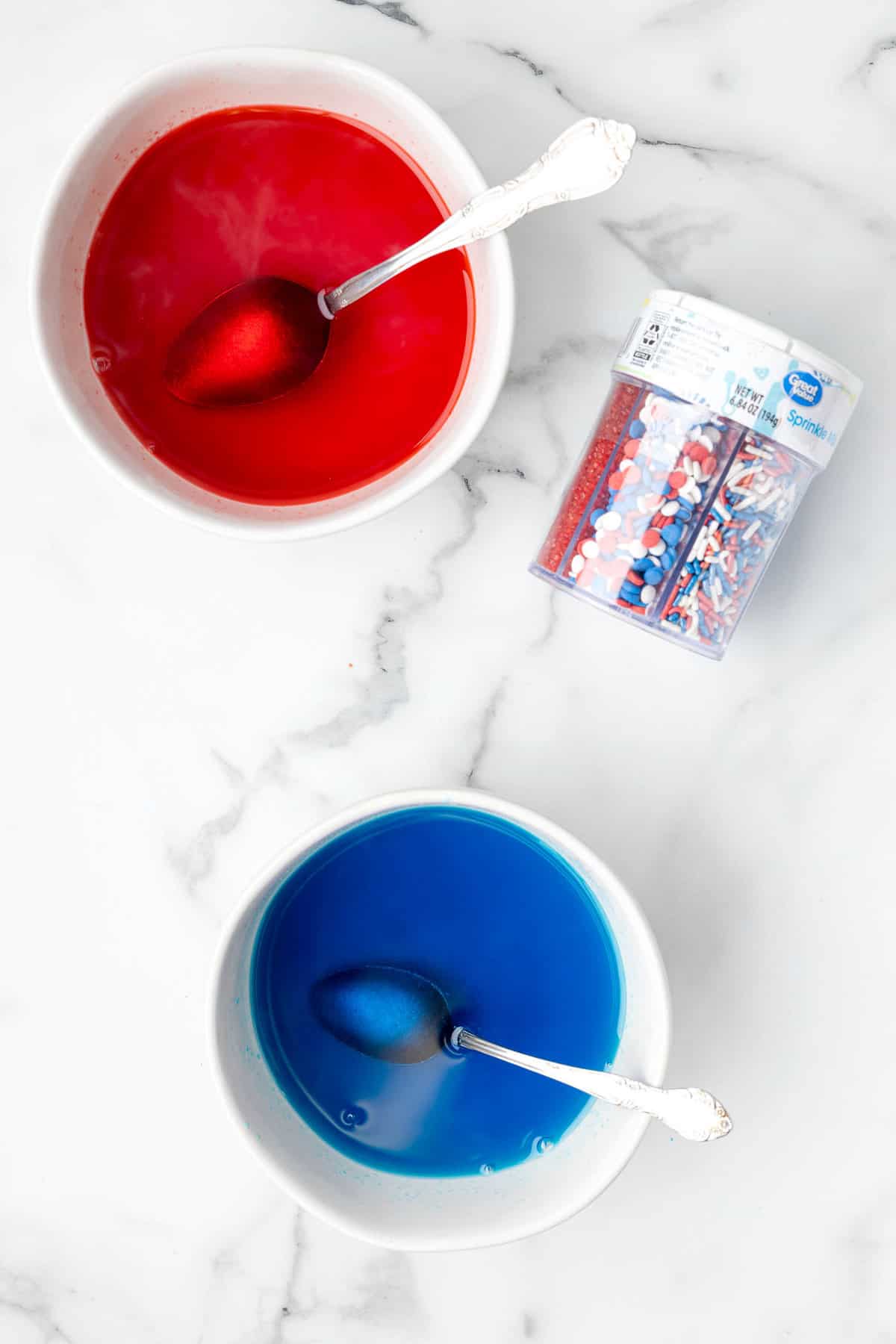 Red and blue jello mixed with hot water for Red White and Blue Jello Cake