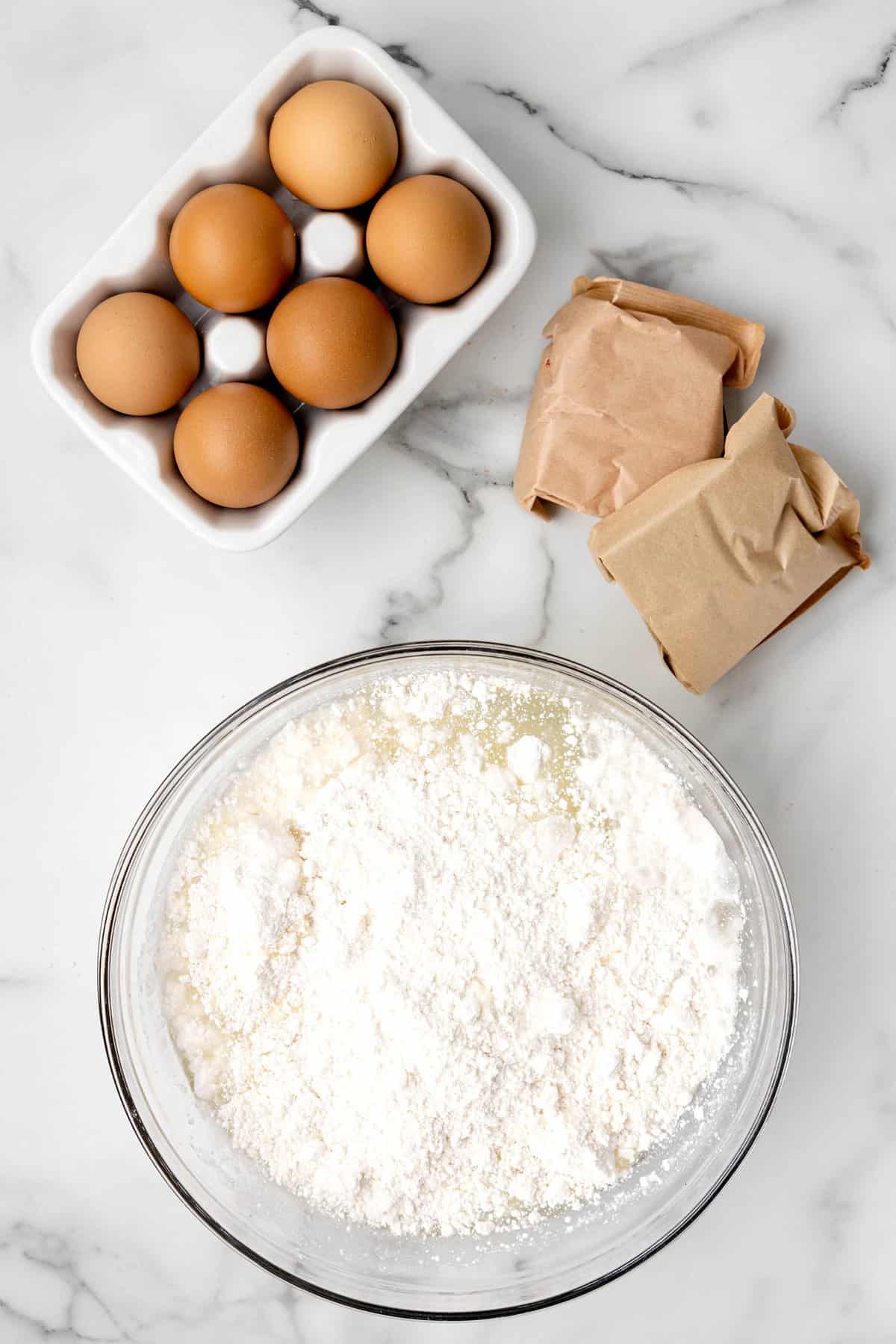 White cake mix in mixing bowl for Mixing white cake mix per box instructions in bowl for 4th of July Jello Cake Recipe