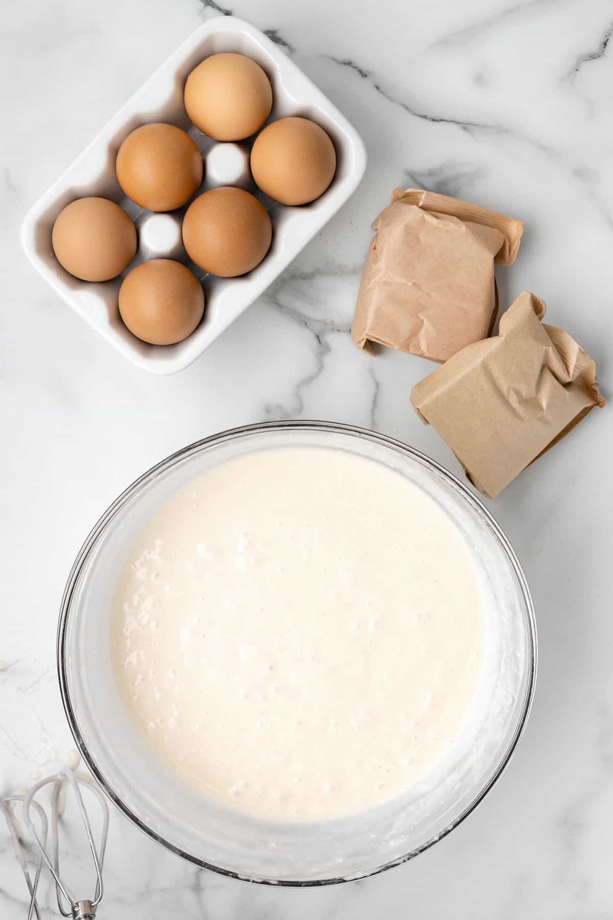 White cake mix made per box instructions in mixing bowl for 4th of July Poke Cake