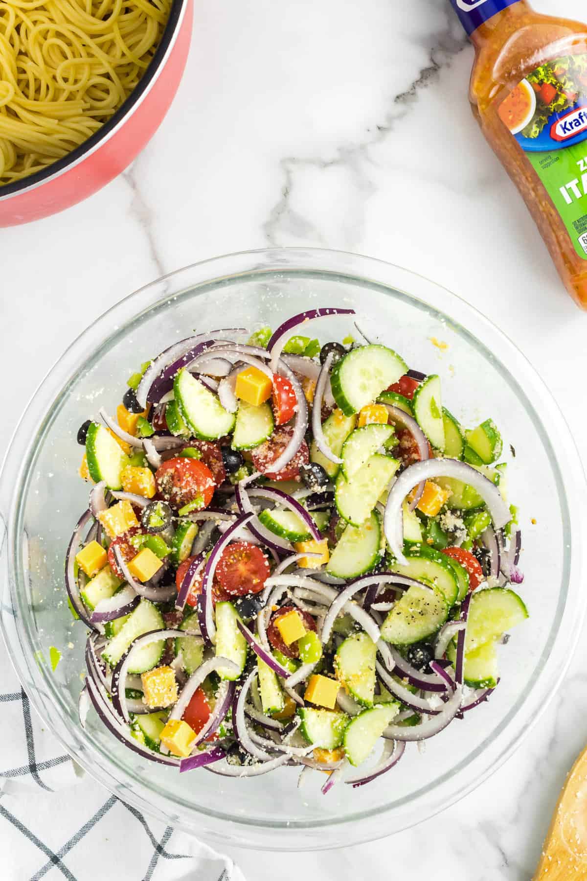 Tossed ingredients in bowl for Spaghetti Salad