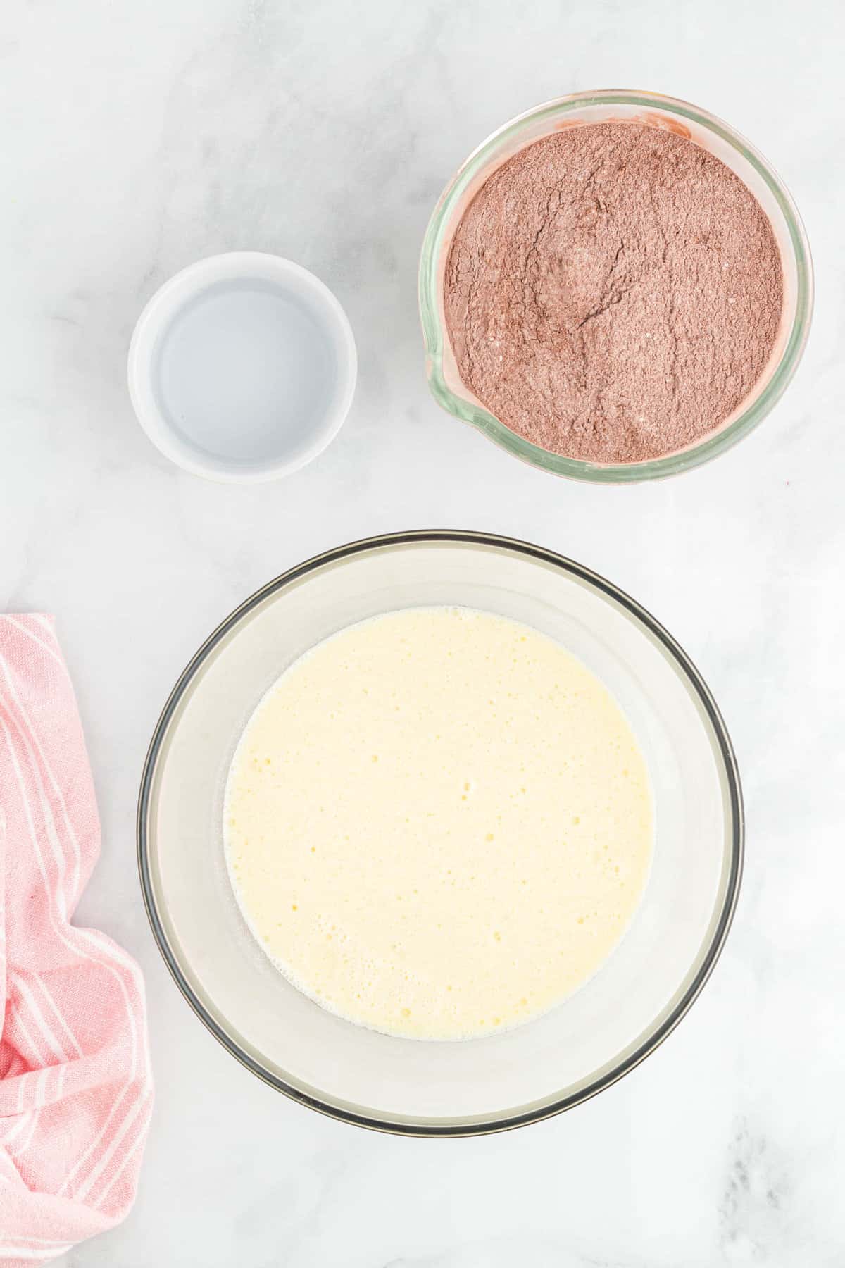 Mixing Ingredients for Chocolate Sheet Cake Recipe in Bowl