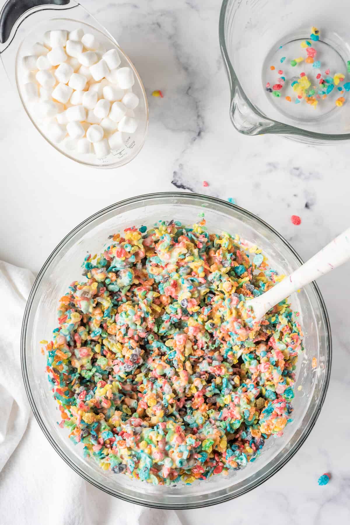 Add in the Fruity Pebbles and Mix together until fully coated with the Marshmallow mixture
