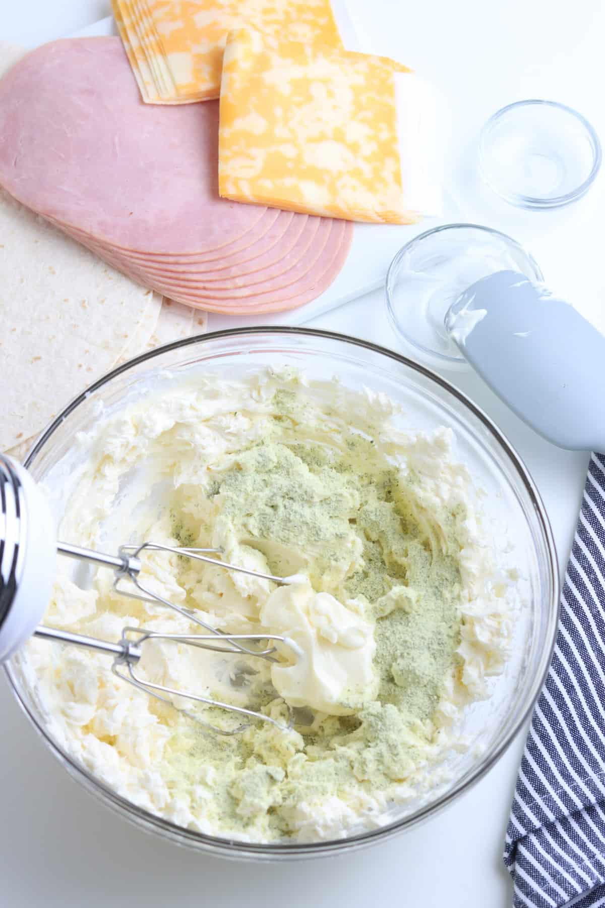 Beat Cream Cheese Until its soft and creamy. Add the Mayonnaise and Ranch Powder to the Cream Cheese.