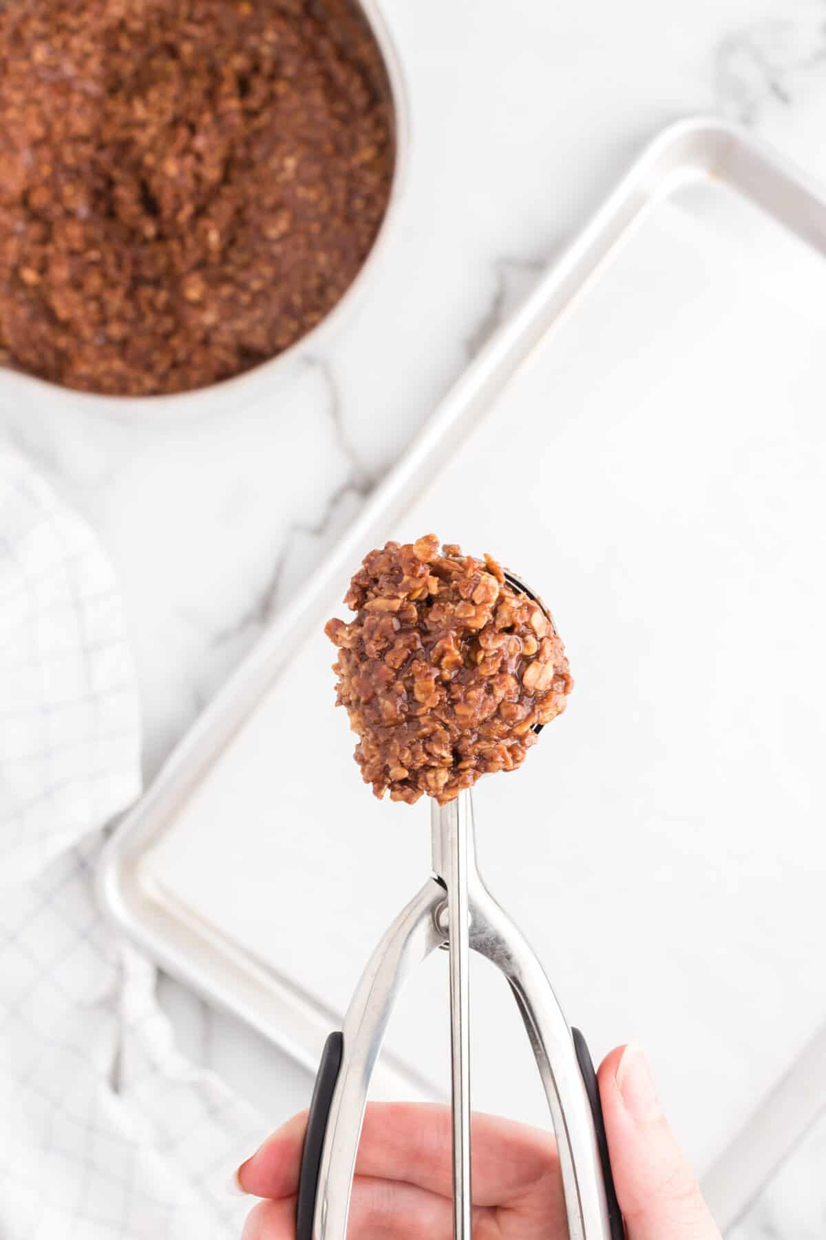 Using a Medium Scoop, drop mixture onto a lined baking sheet.